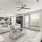living room with large open spaces and excellent lighting from large window/patio doors