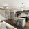 living room with large open spaces and excellent lighting from large window/patio doors