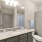 bathroom area with a sink and a stylish faucet