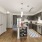 kitchen area on wooden floor with spacious counter-space and designer appliances