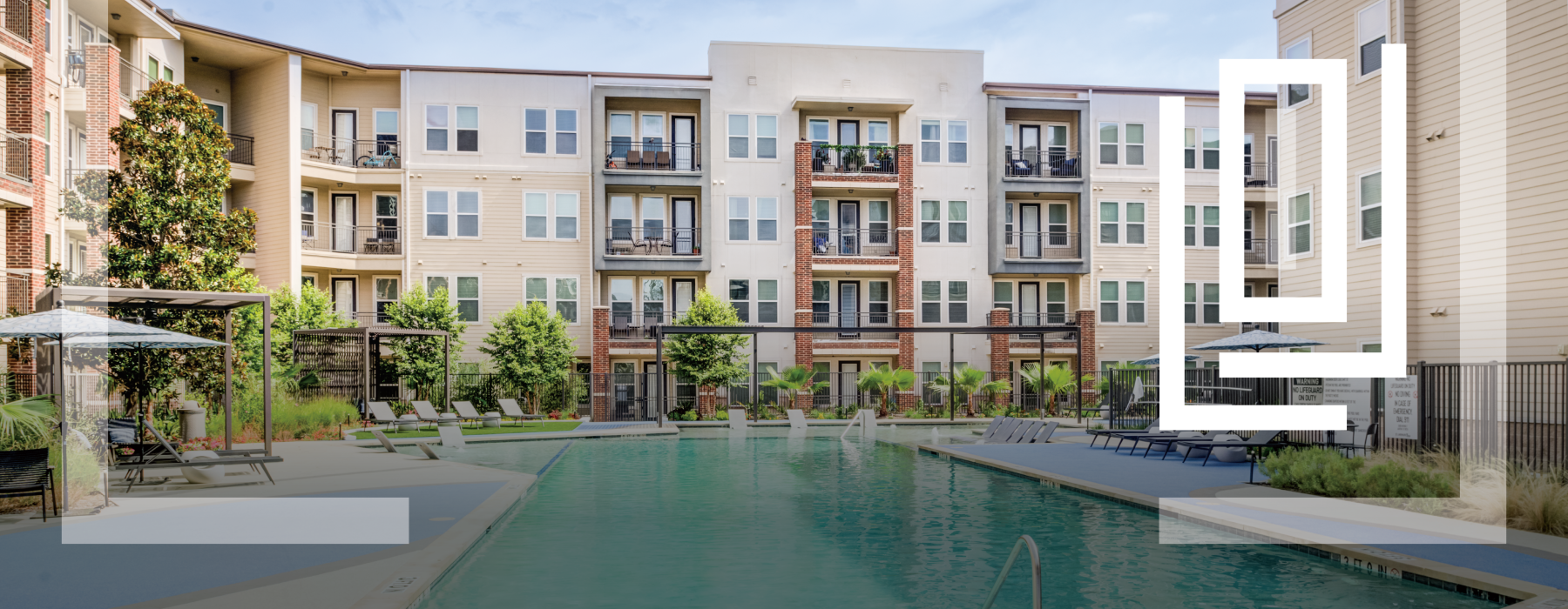 pool with trees, chairs and apartment building
