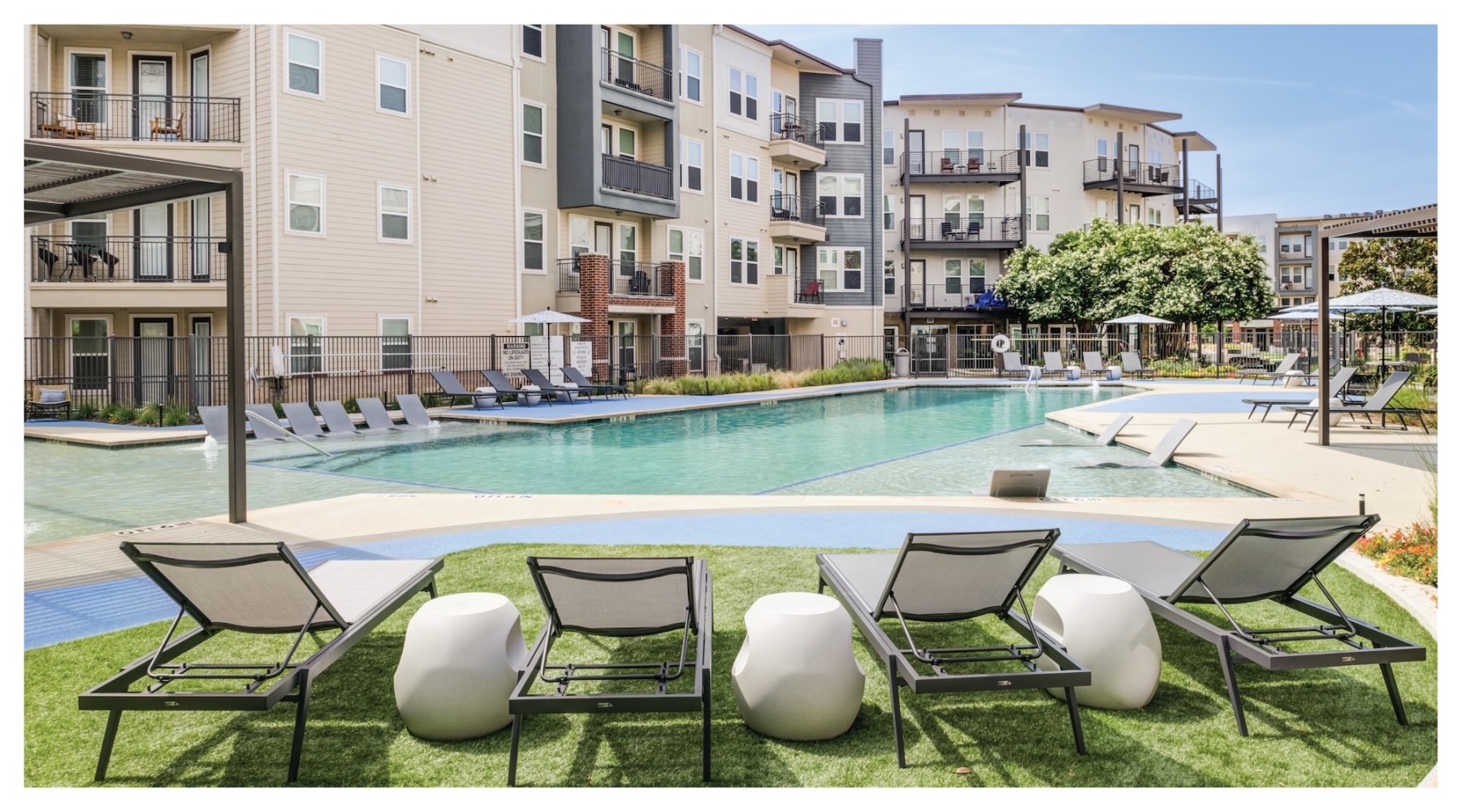 resort style pool with seating in a courtyard