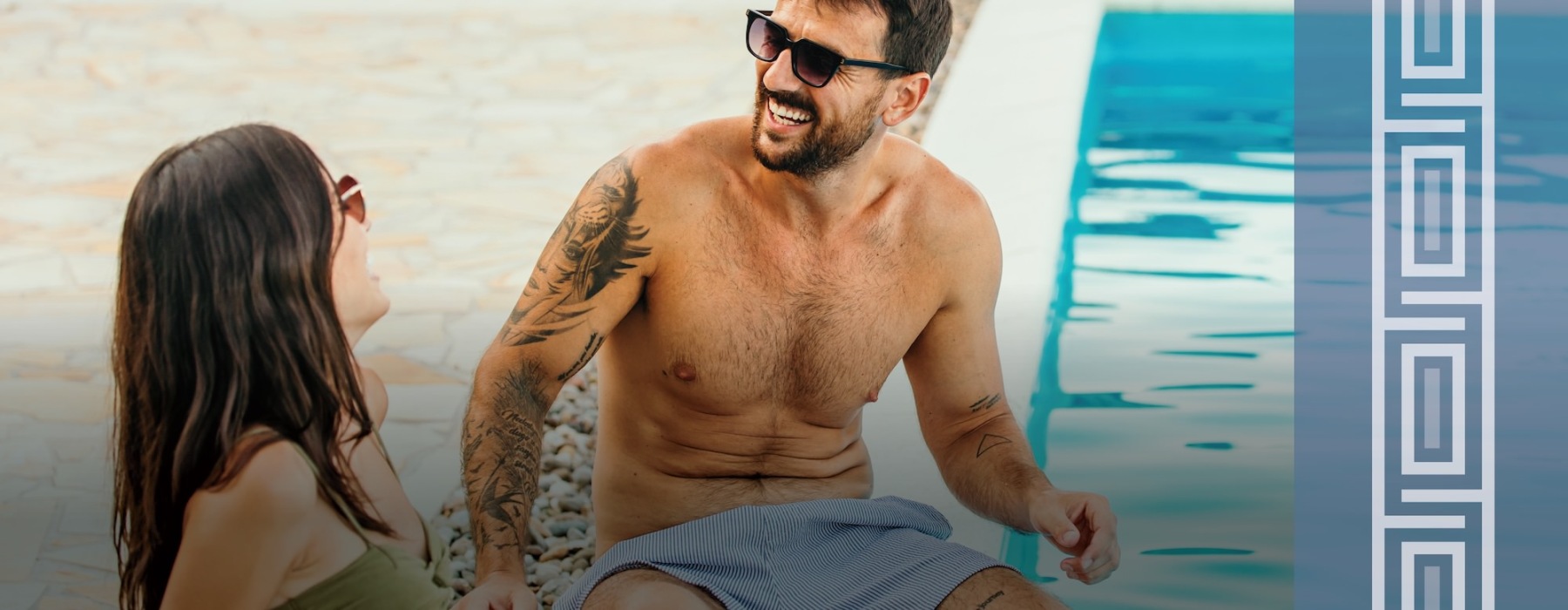 a couple sitting by a pool