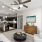 living room with large open spaces and excellent lighting from large window/patio doors